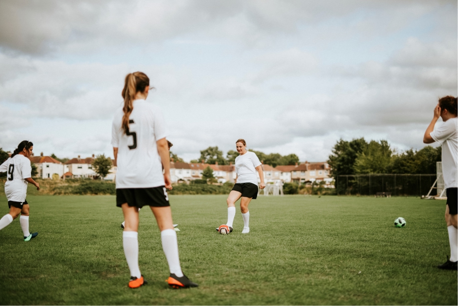Soccer players warming up on the field